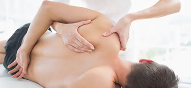 A man receiving a soothing back massage in a tranquil massage room