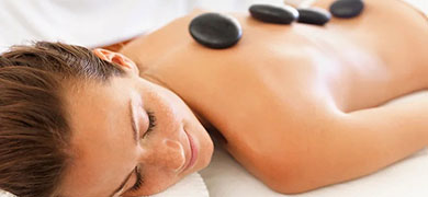 A woman relaxes on a massage table