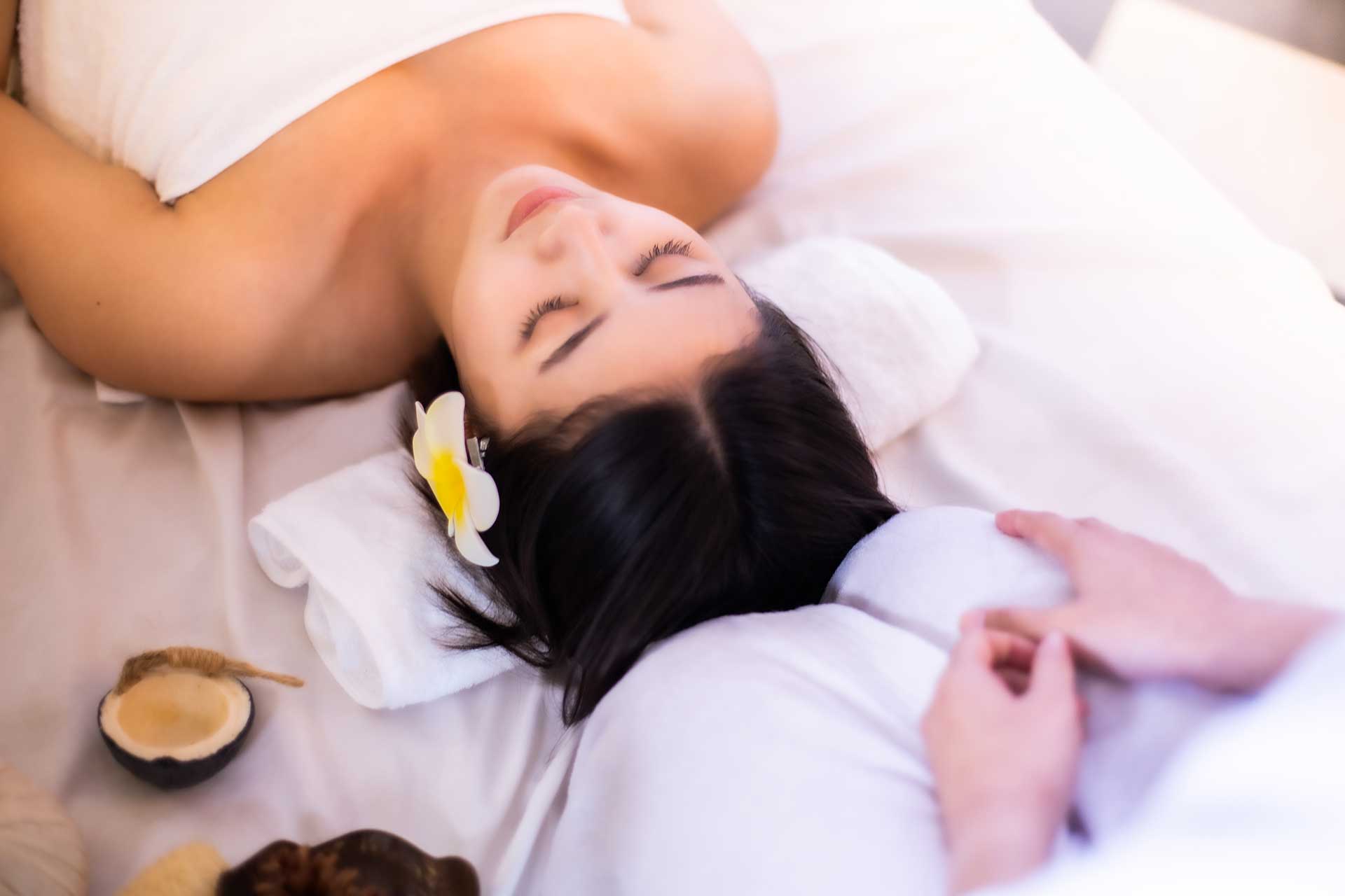 A woman enjoying a relaxing massage services at Chinese Massage Therapy